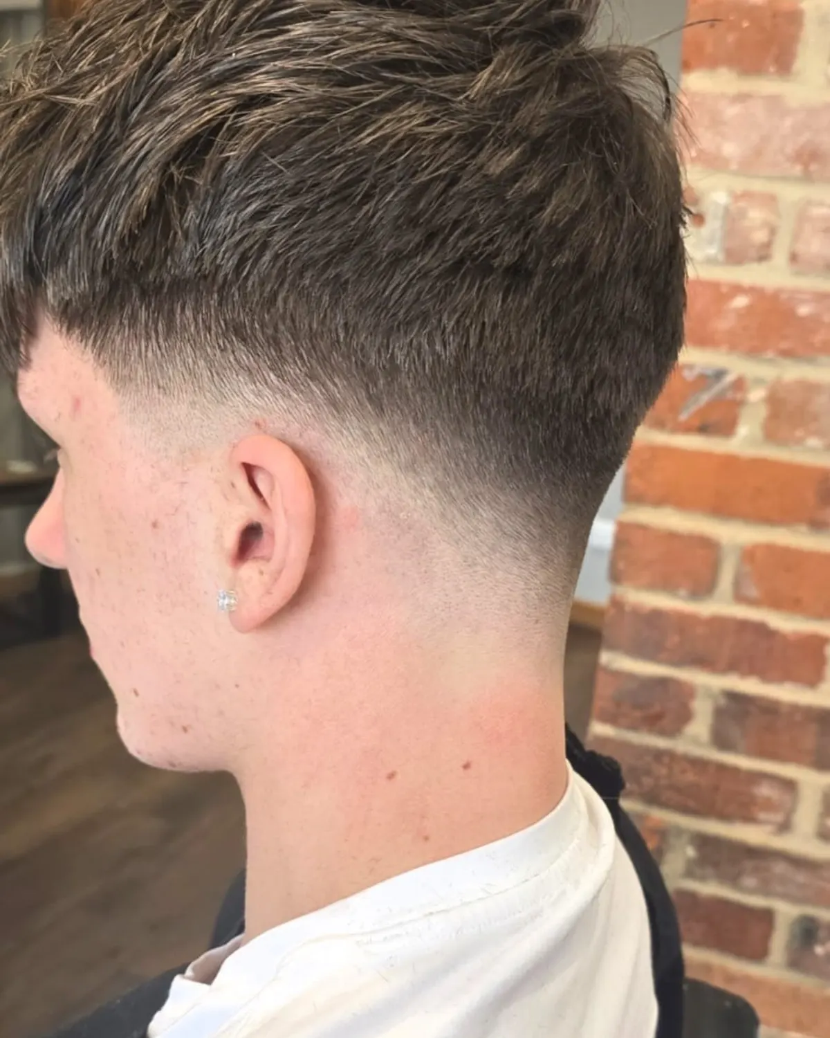 Textured crop with a low drop fade, cut at Primo Hair Lounge Ipswich