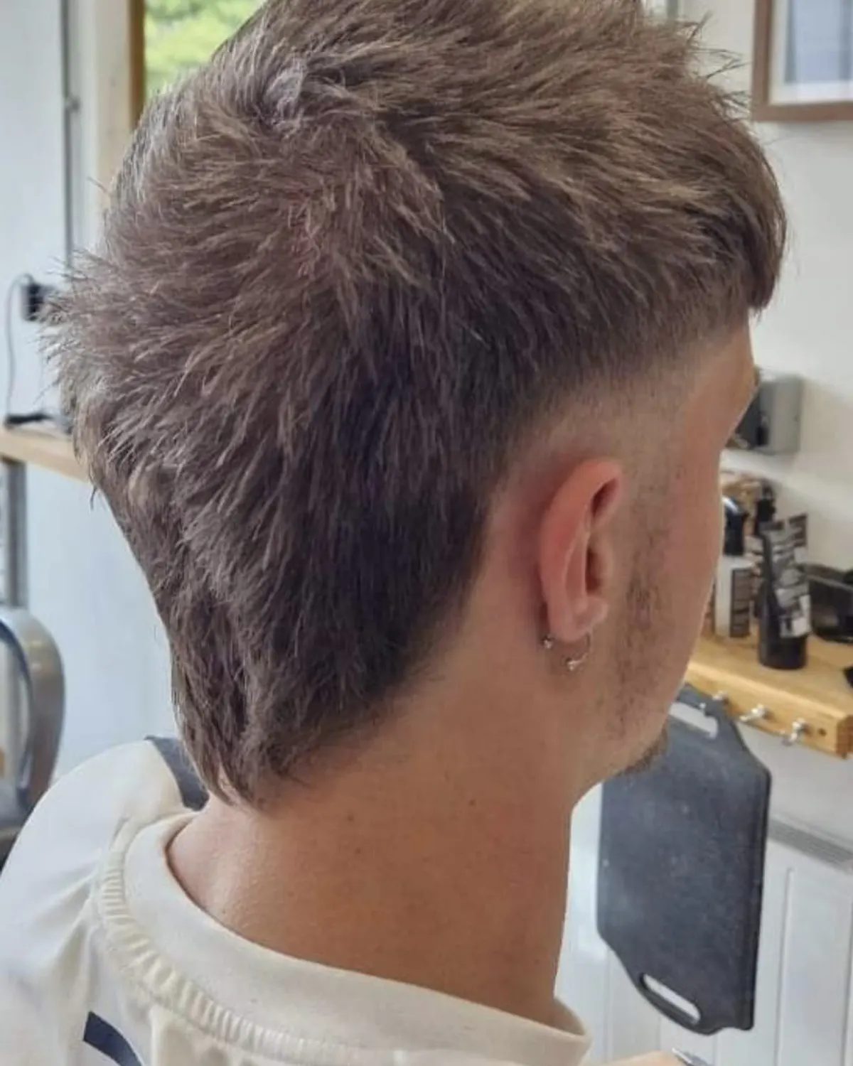 Spiky textured top with a mid fade, cut at Primo Hair Lounge Ipswich